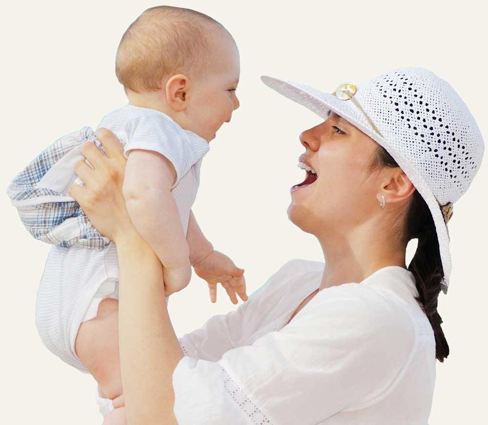 Happy mother holding baby in air