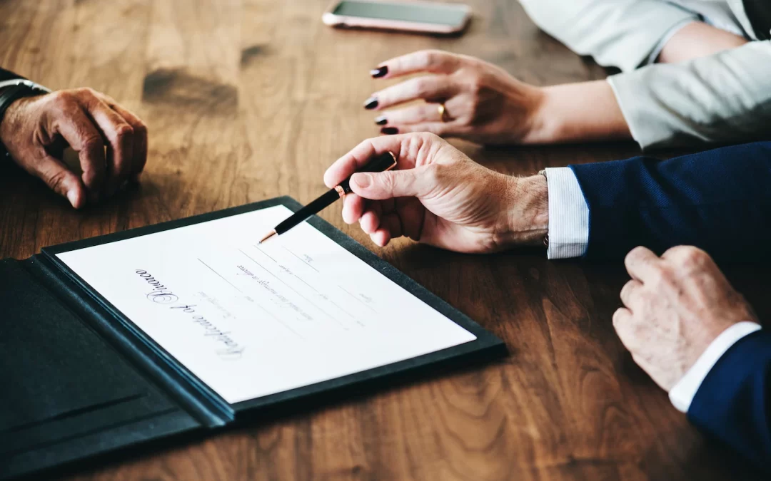 Family lawyer and couple signing certificate of divorce