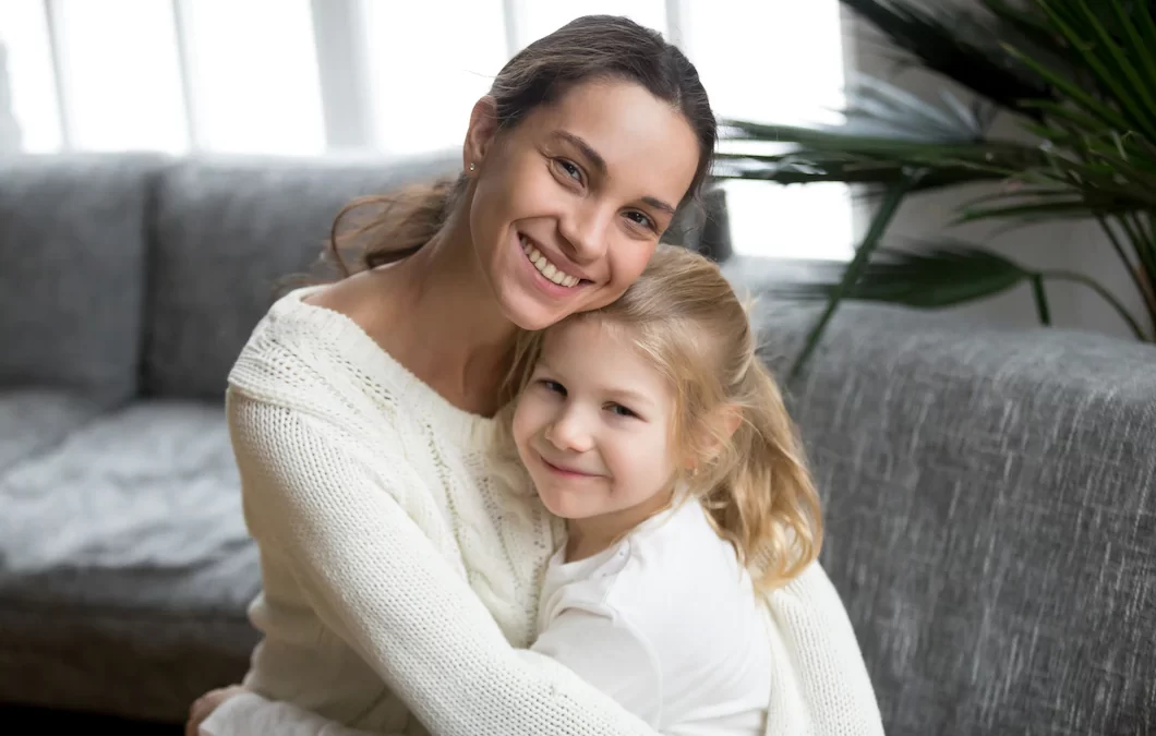 Happy mother and daughter hugging